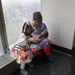 Bangladeshi immigrant Khadijatul Rahman, 29, holds her baby boy Zavyaan, 2 weeks, with daughter Labeebah, 6, looking on, after becoming a U.S. citizen at a naturalization ceremony held atop the One World Trade Center <br>